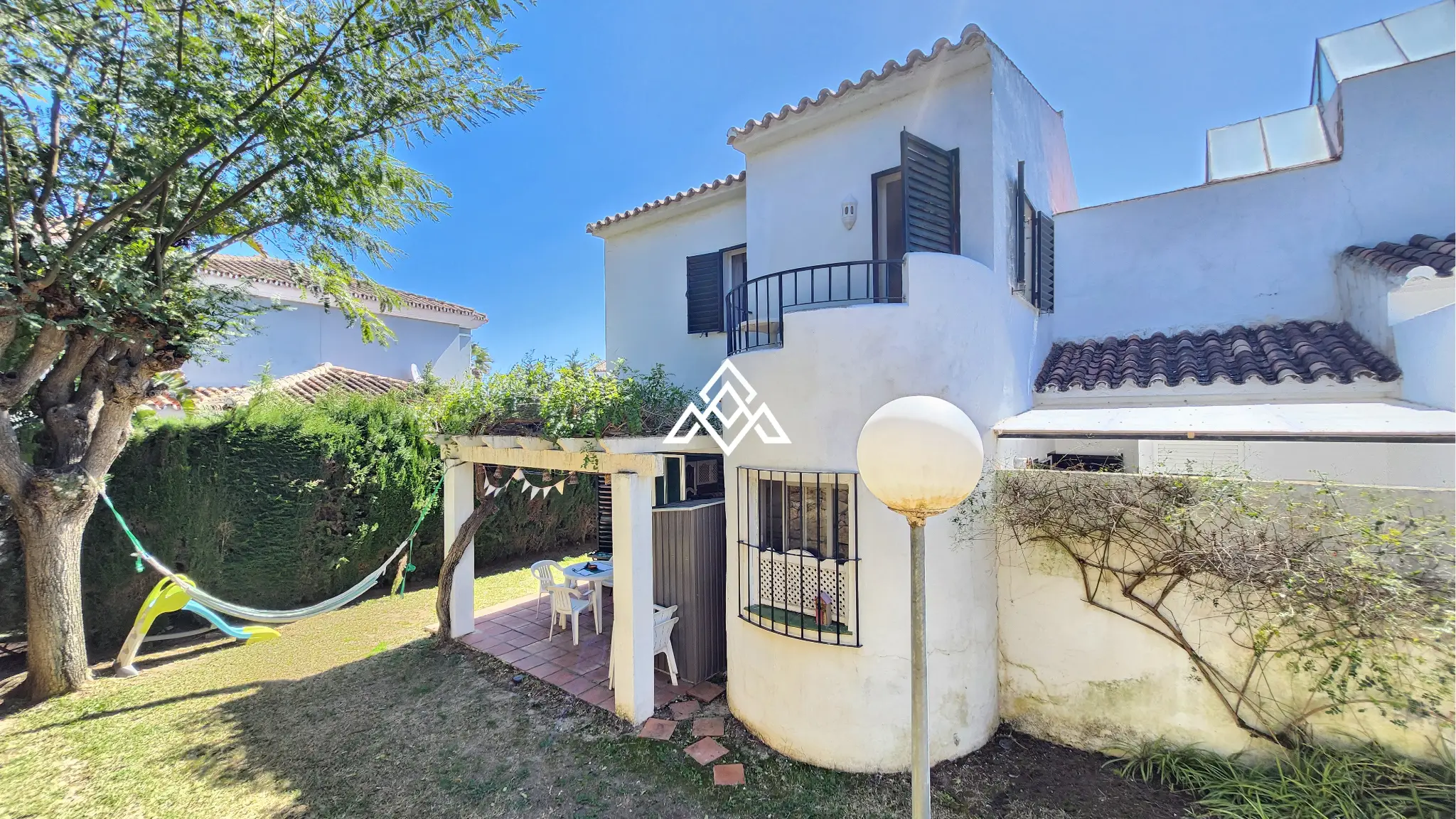 Corner Monte Biarritz townhouse with garden and terraces, near San Pedro