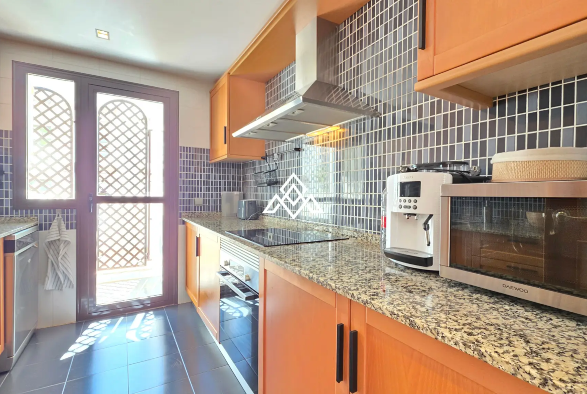Selwo apartment with terrace, pool and gardens in gated community Estepona