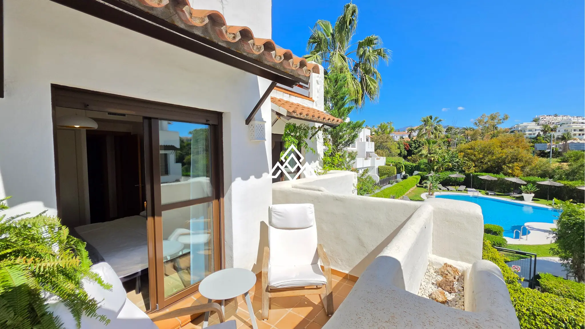 Selwo apartment with terrace, pool and gardens in gated community Estepona