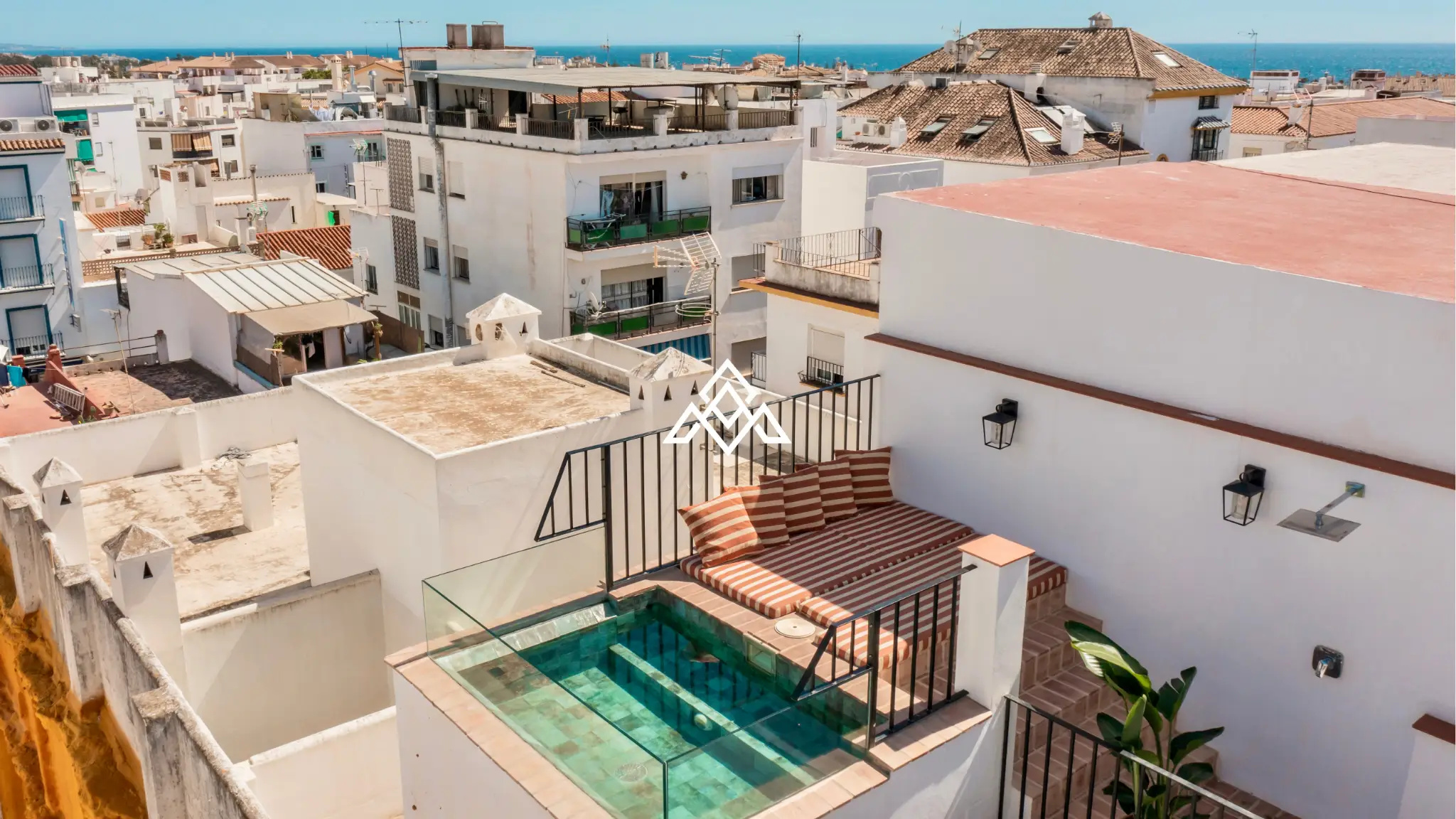Designer townhouse with rooftop pool and panoramic sea views on Costa del Sol