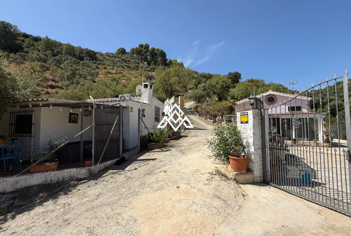 Charming Rustic Estate Monda with two independent homes, mountain views and 3,200 m² of land. Spain real estate investment near Málaga.