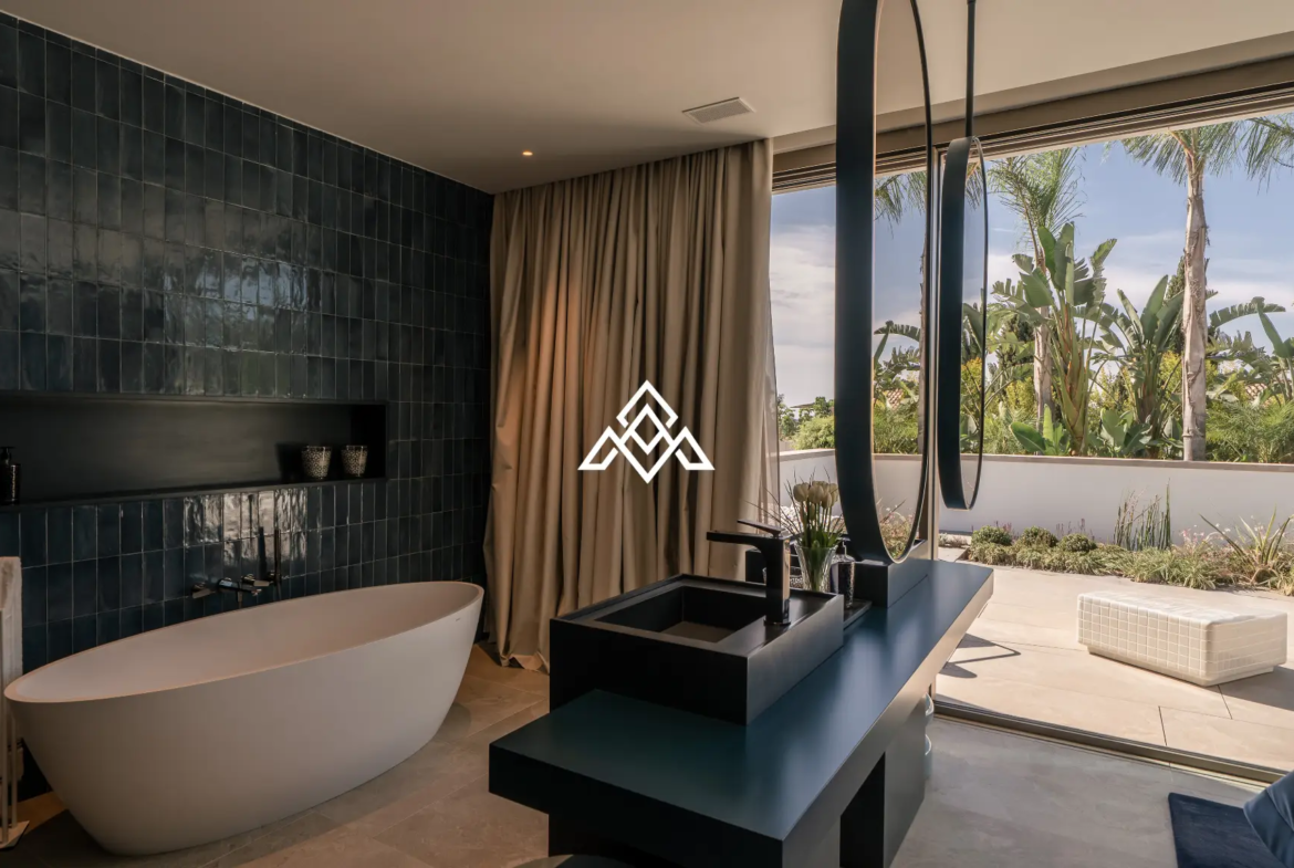 Luxury La Reserva villa for sale in Sotogrande with panoramic sea views and indoor swimming pool.