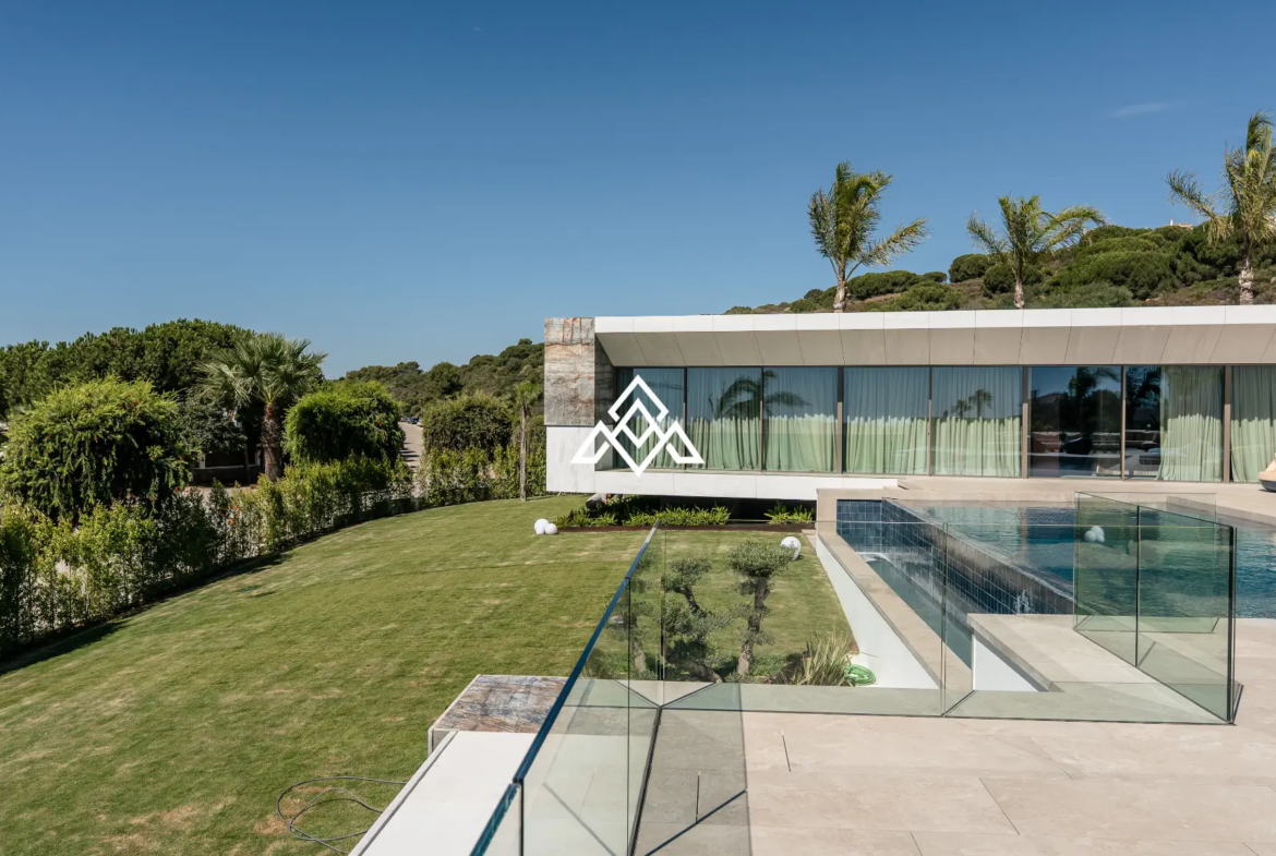 Luxury La Reserva villa for sale in Sotogrande with panoramic sea views and indoor swimming pool.