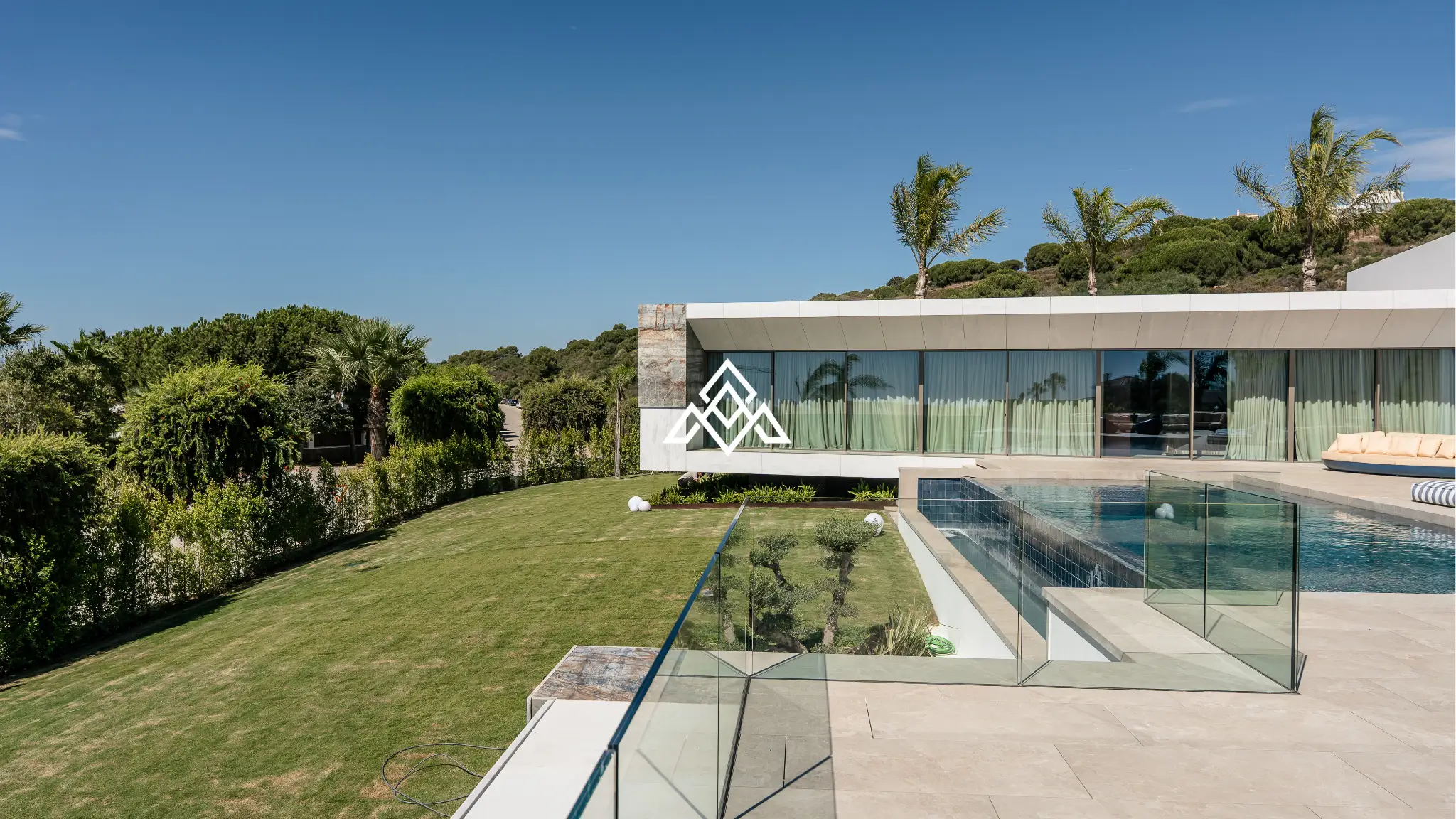 Luxury La Reserva villa for sale in Sotogrande with panoramic sea views and indoor swimming pool.