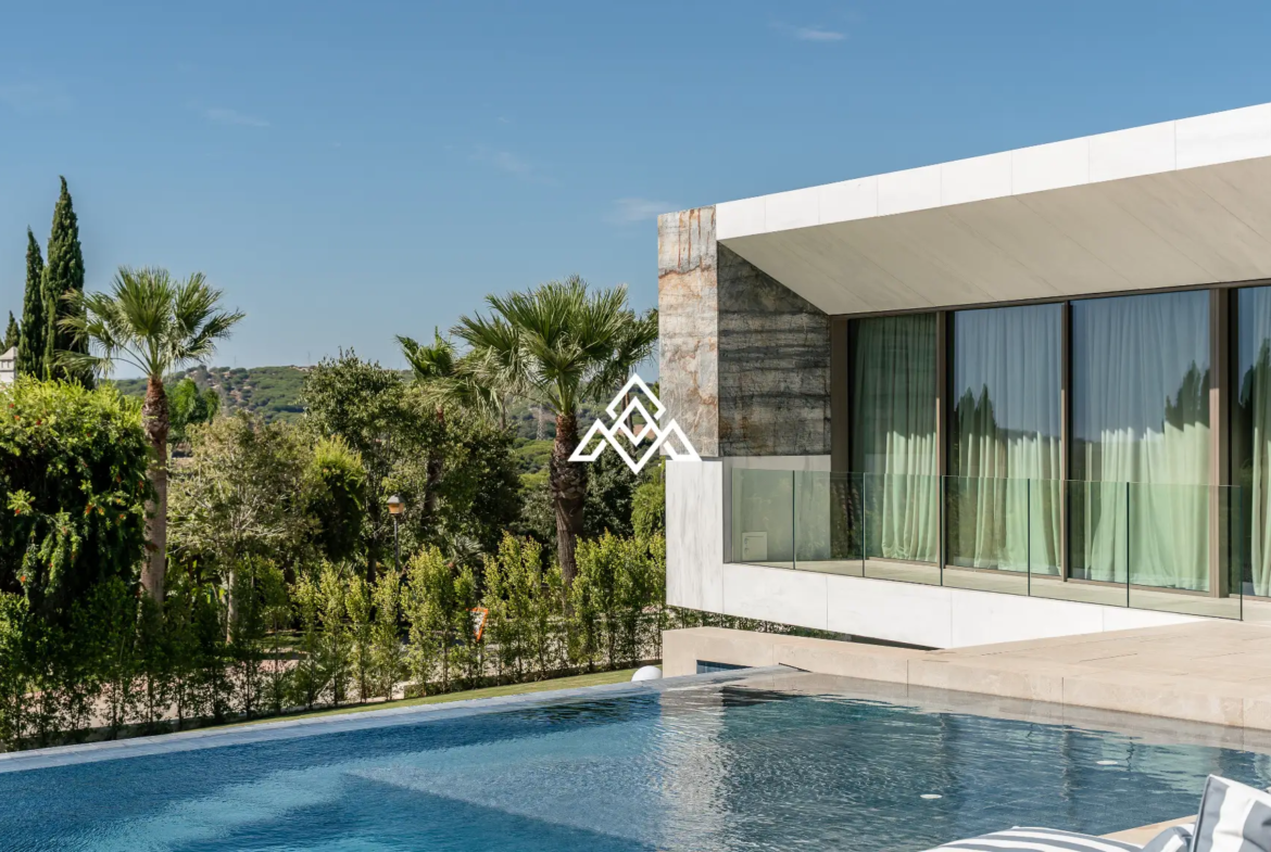 Luxury La Reserva villa for sale in Sotogrande with panoramic sea views and indoor swimming pool.