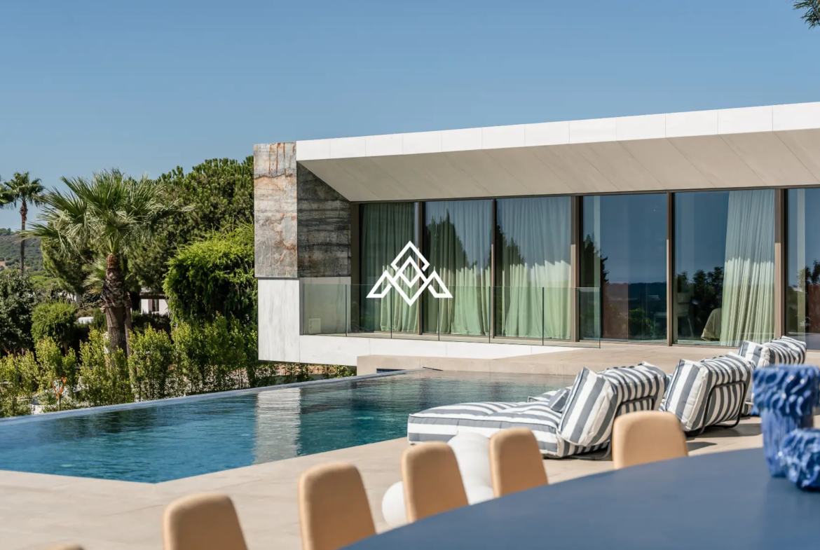 Luxury La Reserva villa for sale in Sotogrande with panoramic sea views and indoor swimming pool.
