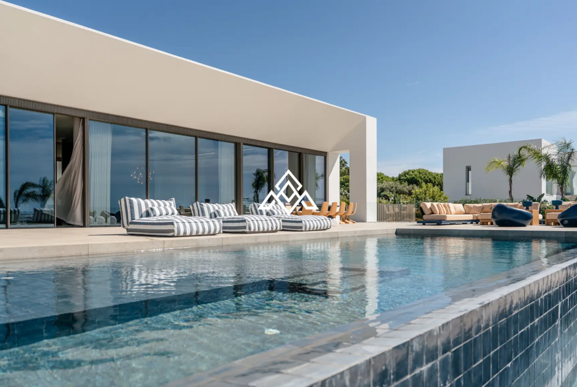 Luxury La Reserva villa for sale in Sotogrande with panoramic sea views and indoor swimming pool.