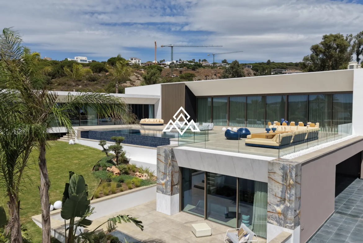 Luxury La Reserva villa for sale in Sotogrande with panoramic sea views and indoor swimming pool.