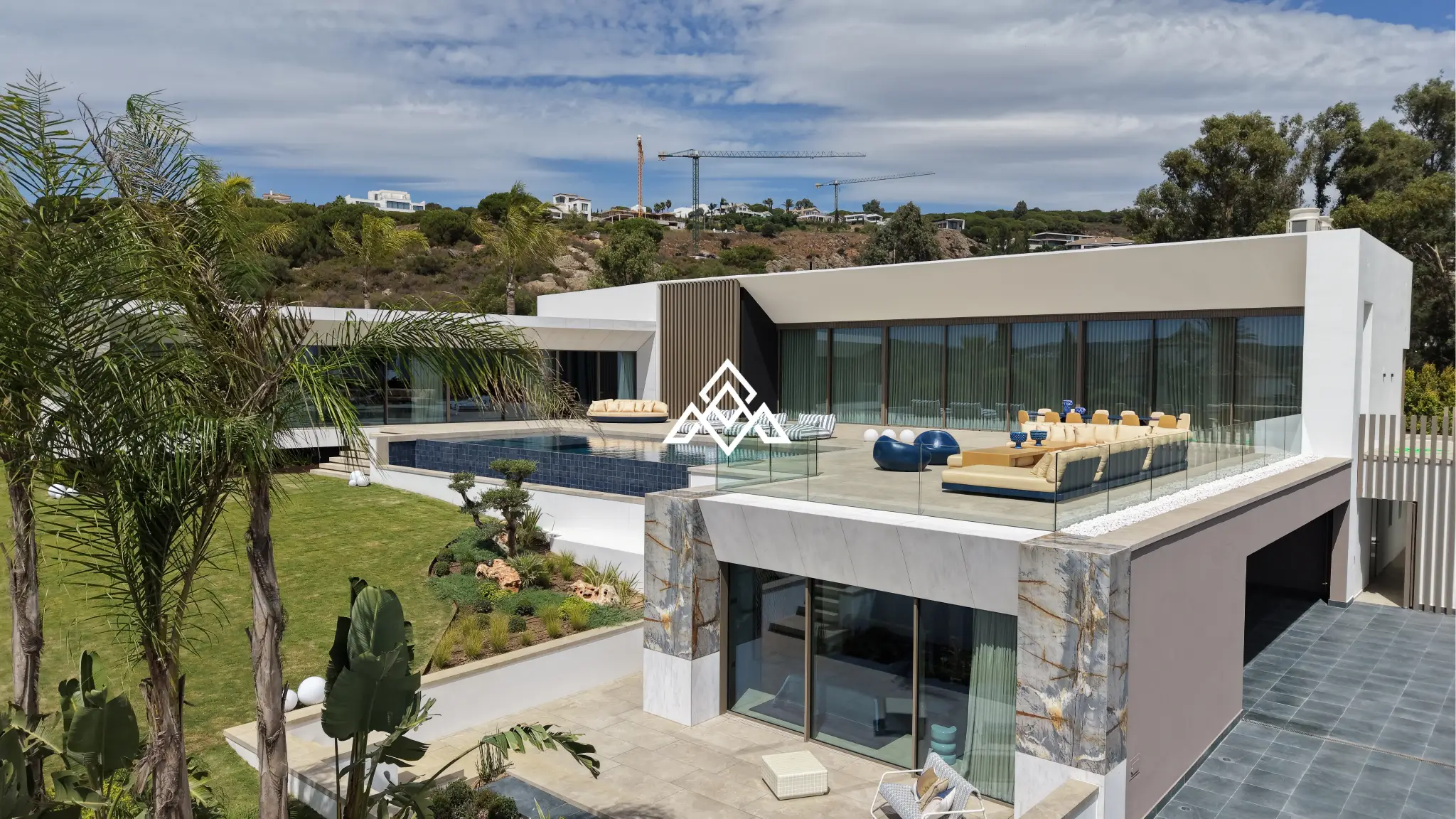 Luxury La Reserva villa for sale in Sotogrande with panoramic sea views and indoor swimming pool.