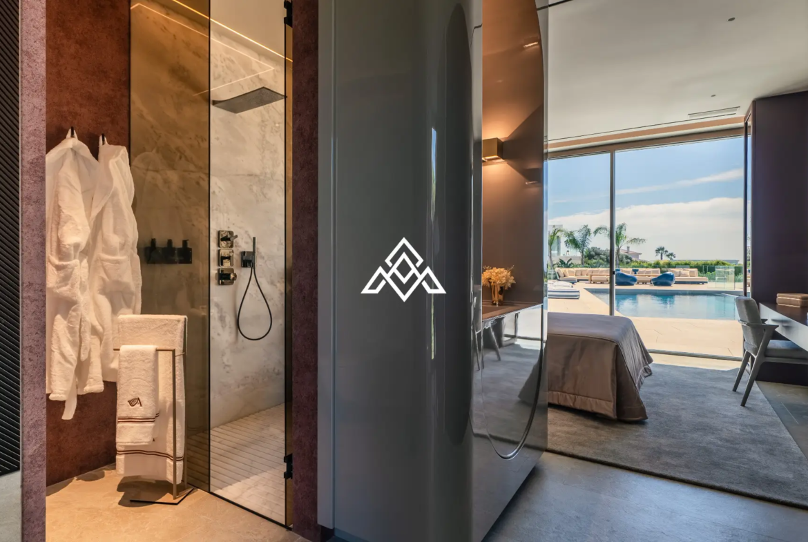 Luxury La Reserva villa for sale in Sotogrande with panoramic sea views and indoor swimming pool.