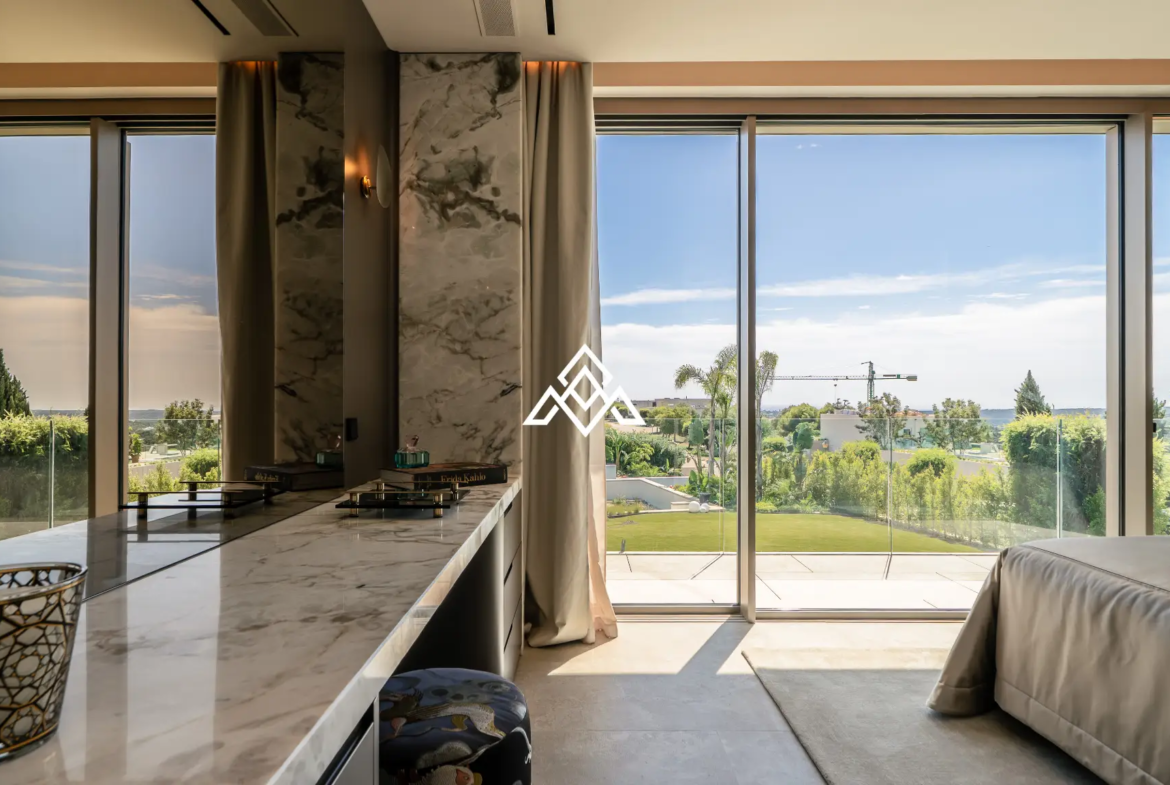 Luxury La Reserva villa for sale in Sotogrande with panoramic sea views and indoor swimming pool.