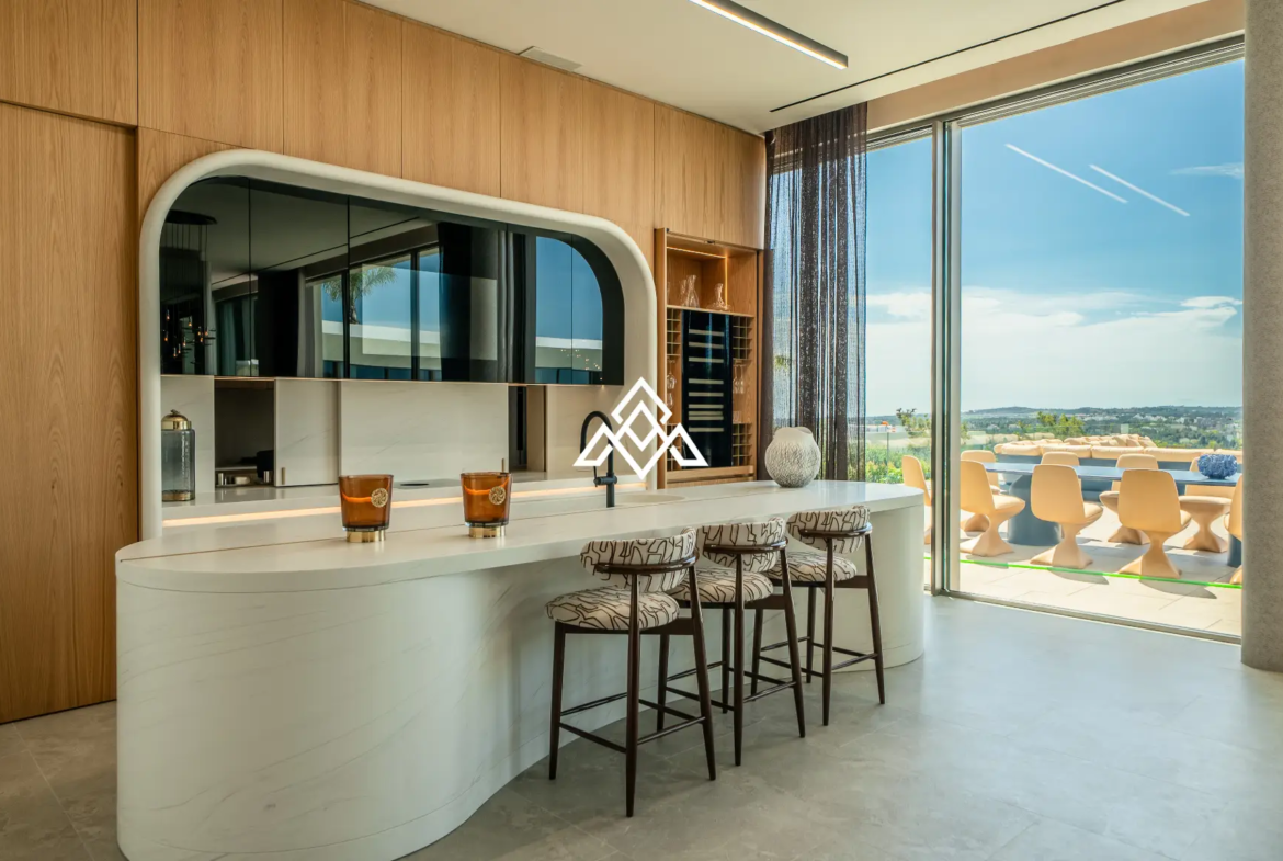 Luxury La Reserva villa for sale in Sotogrande with panoramic sea views and indoor swimming pool.