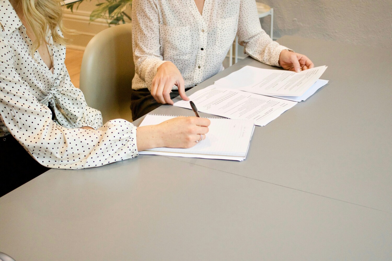 Client and lawyer signing purchase documents when buying property Costa del Sol